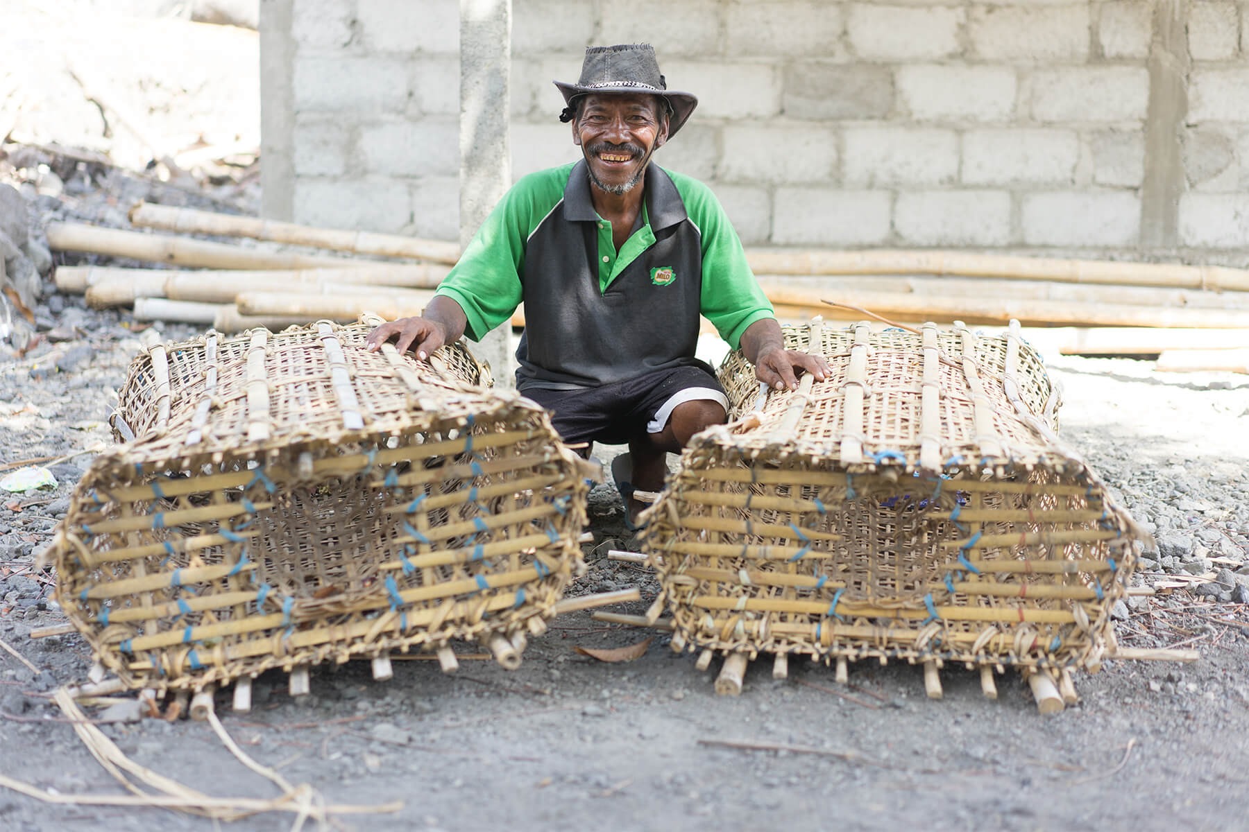 Antonio proudly shows his fishing baskets